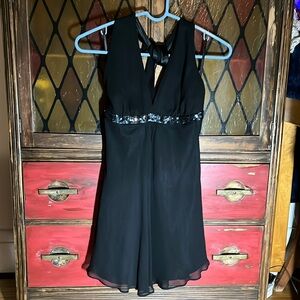 Express Black flowy Chiffon halter top with satin lining, sequin strip.